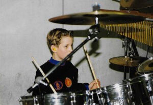Little Chase Miles playing the drums